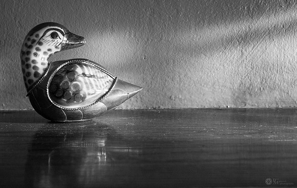 Bird Figurine on Mantle in Early Morning Light