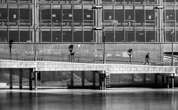Man Walking on the Milwaukee Riverwalk